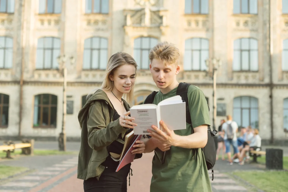 couple-students-standing-near-college