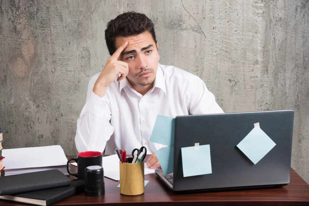 office-employee-looking-laptop-office-desk